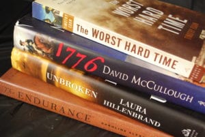File of Books (The Worst Hard Time by Timothy Egan, 1776 by David McCullough, Unbroken by Laura Hillenbrand and The Endurance by Caroline Alexander)